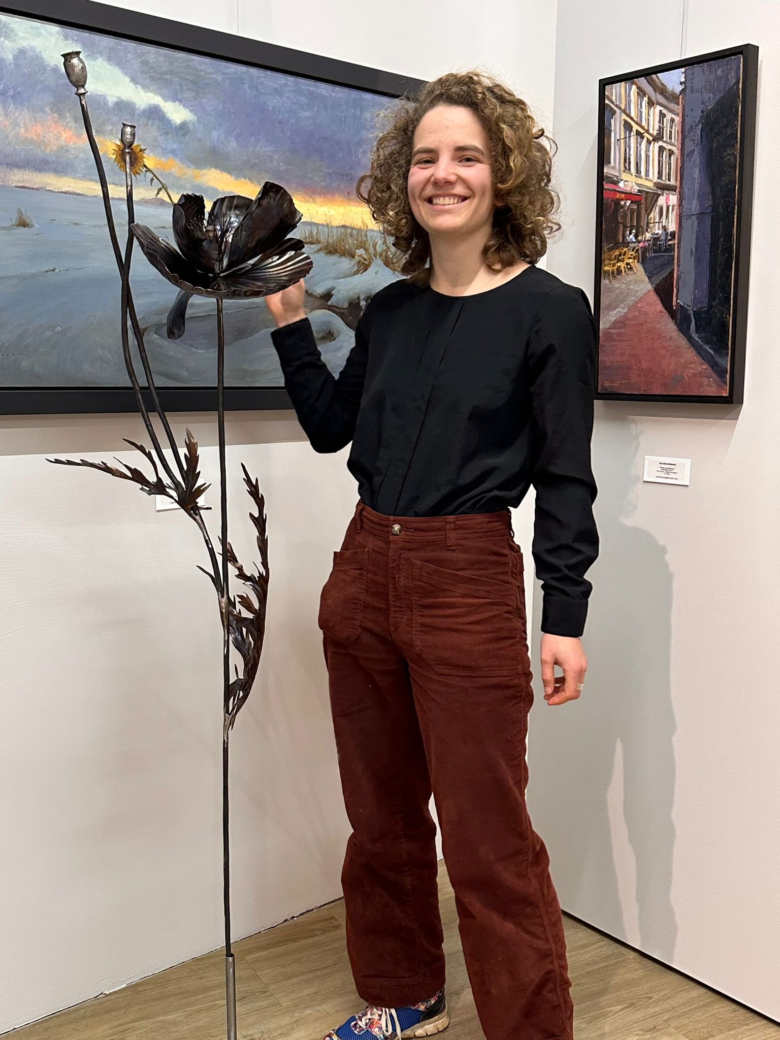 Rachel Climo at Galerie Bonnard with her metal sculpure flower art