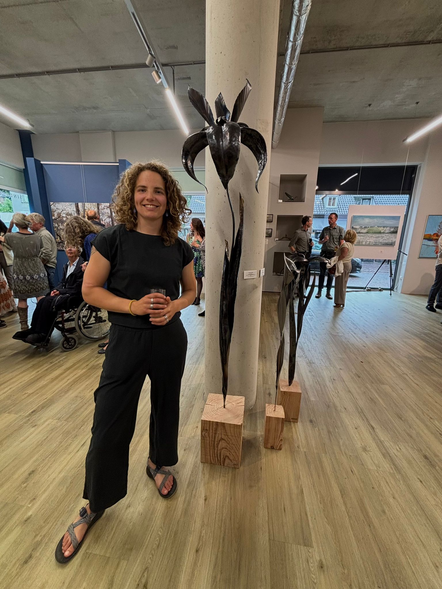 Rachel Climo at Galerie Bonnard with her metal sculpure flower art
