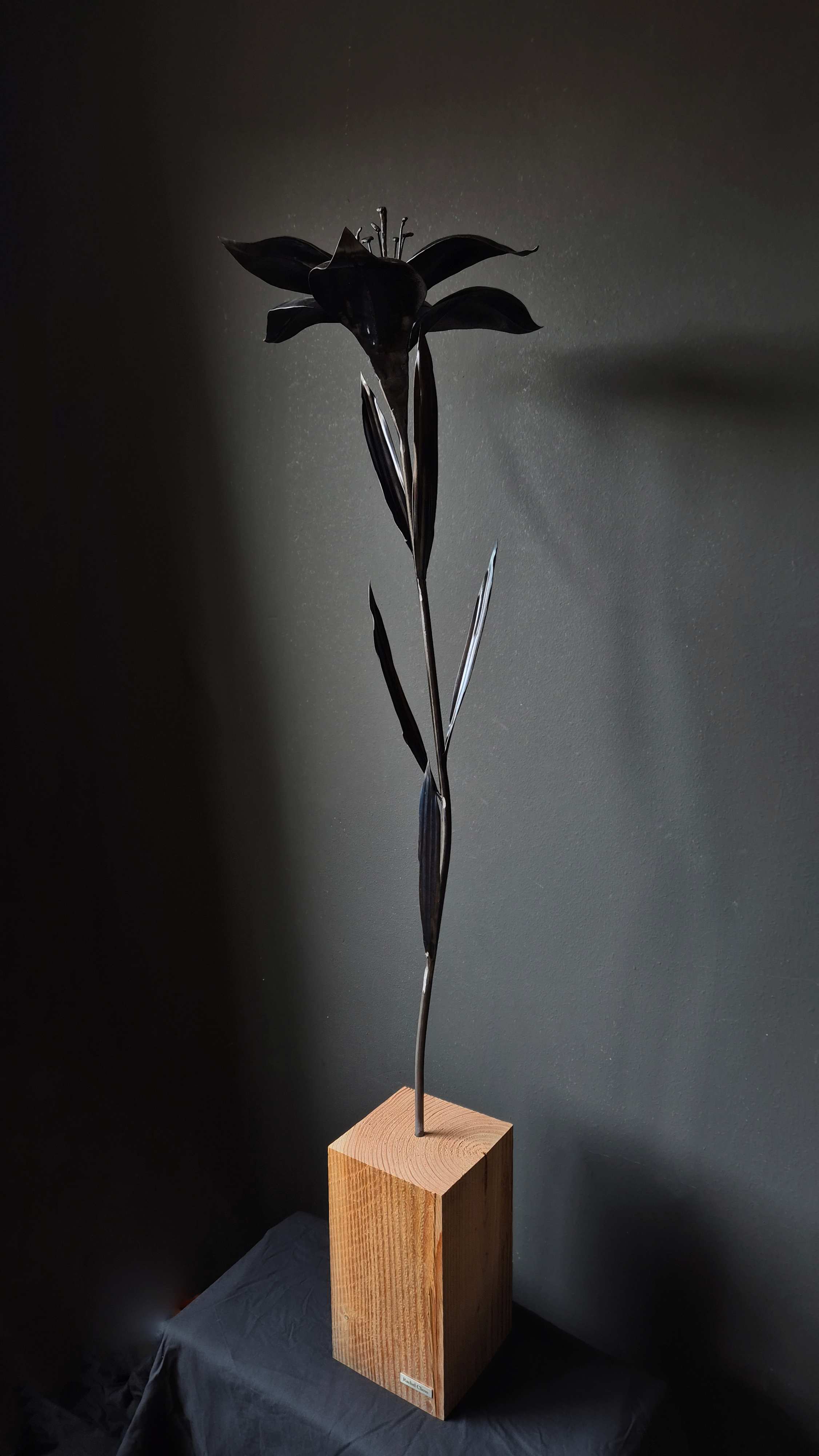 Metalartwork made by Rachel Climo lily, calla lily, yellow iris and gloriosa lily