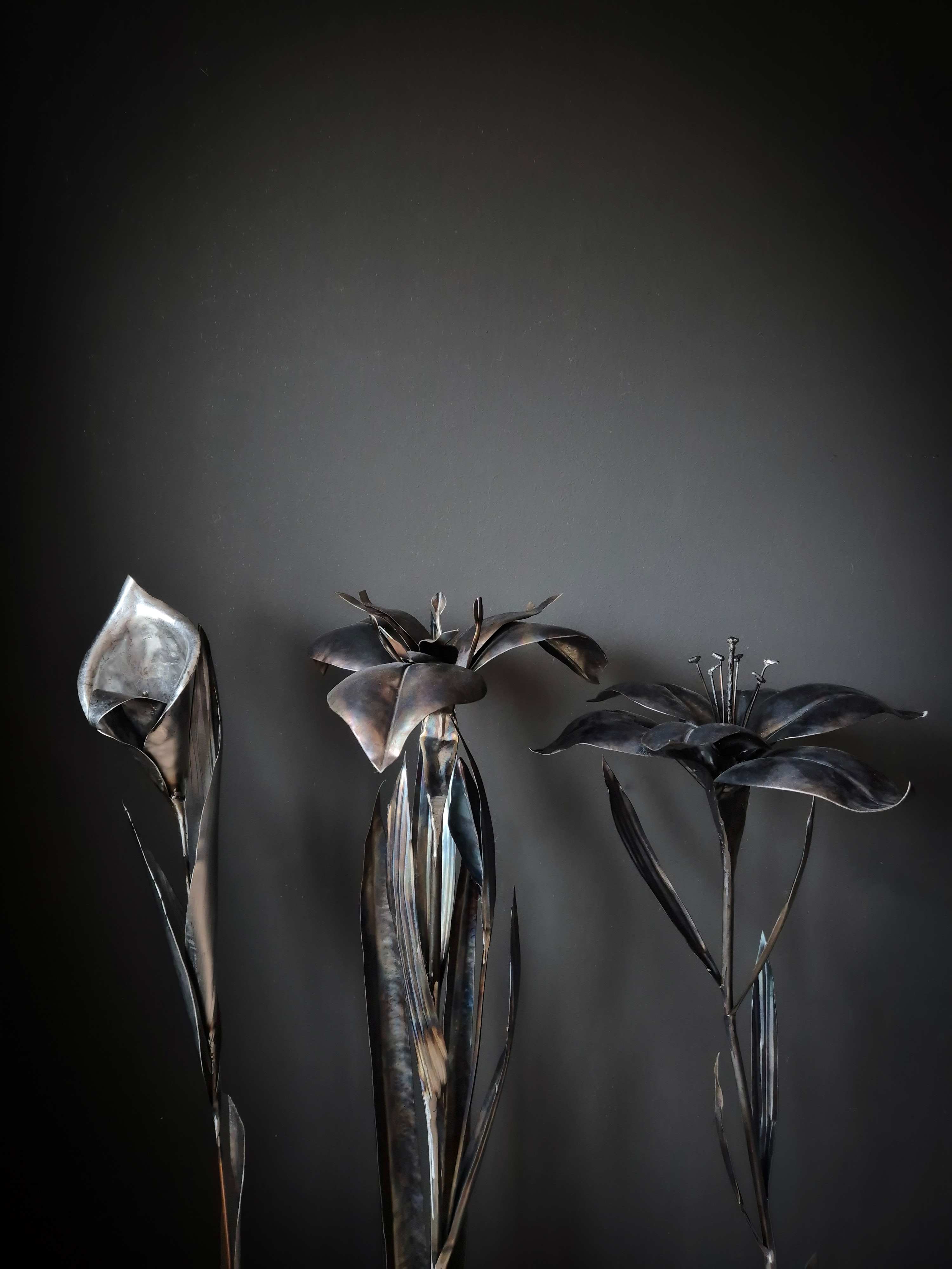 Metalartwork made by Rachel Climo lily, calla lily, yellow iris and gloriosa lily