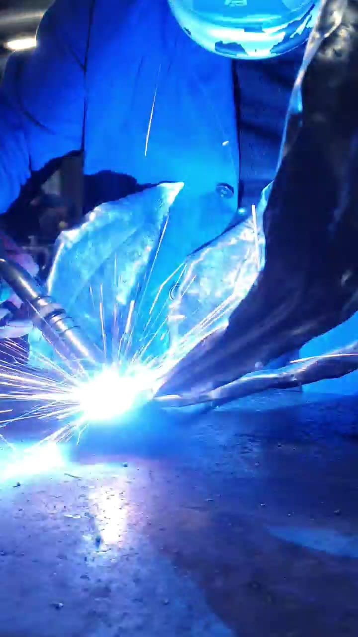 Rachel Climo making metalartwork, welding the gloriosa lily