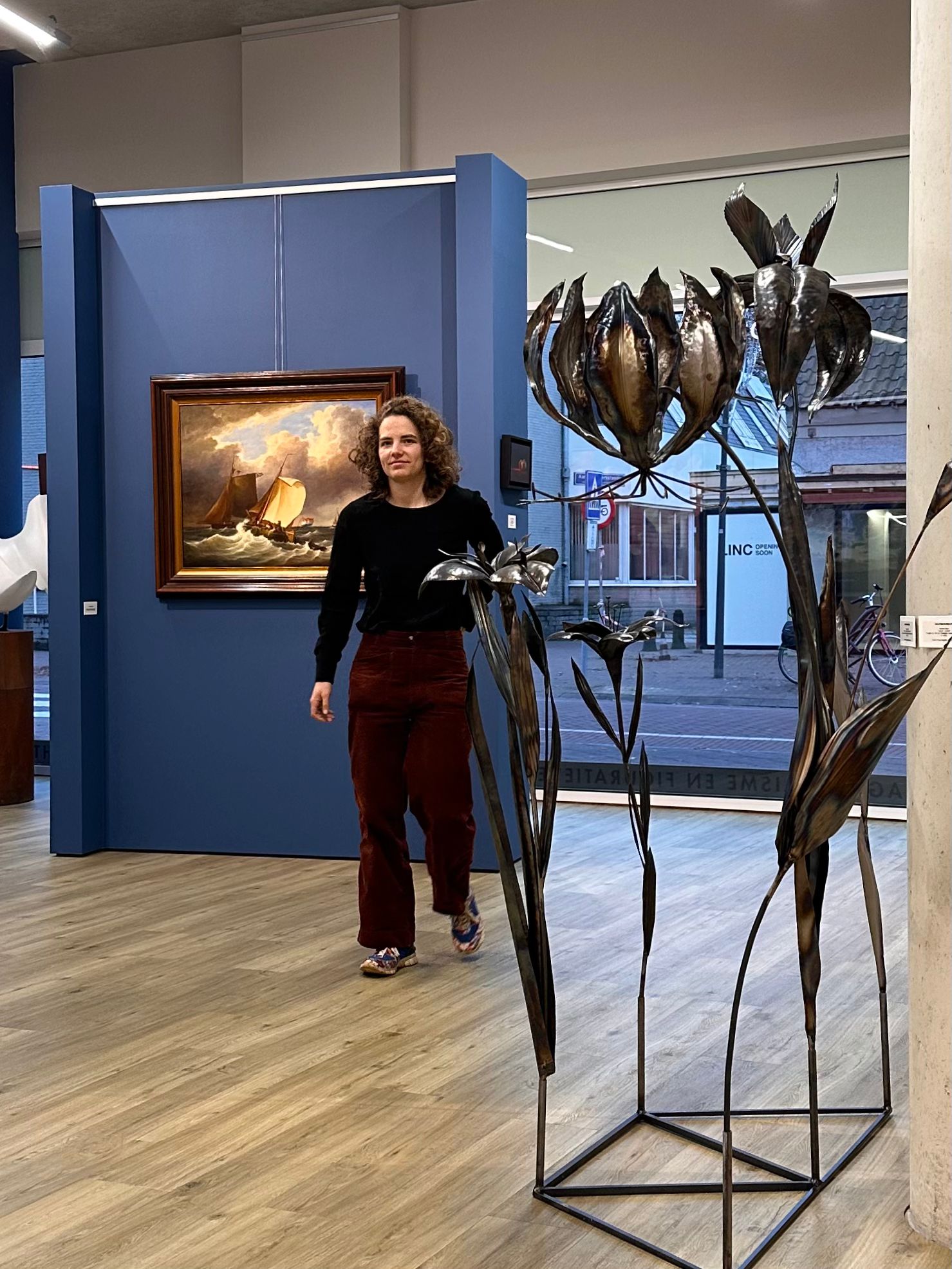Rachel Climo at Galerie Bonnard with her metal sculpure flower art